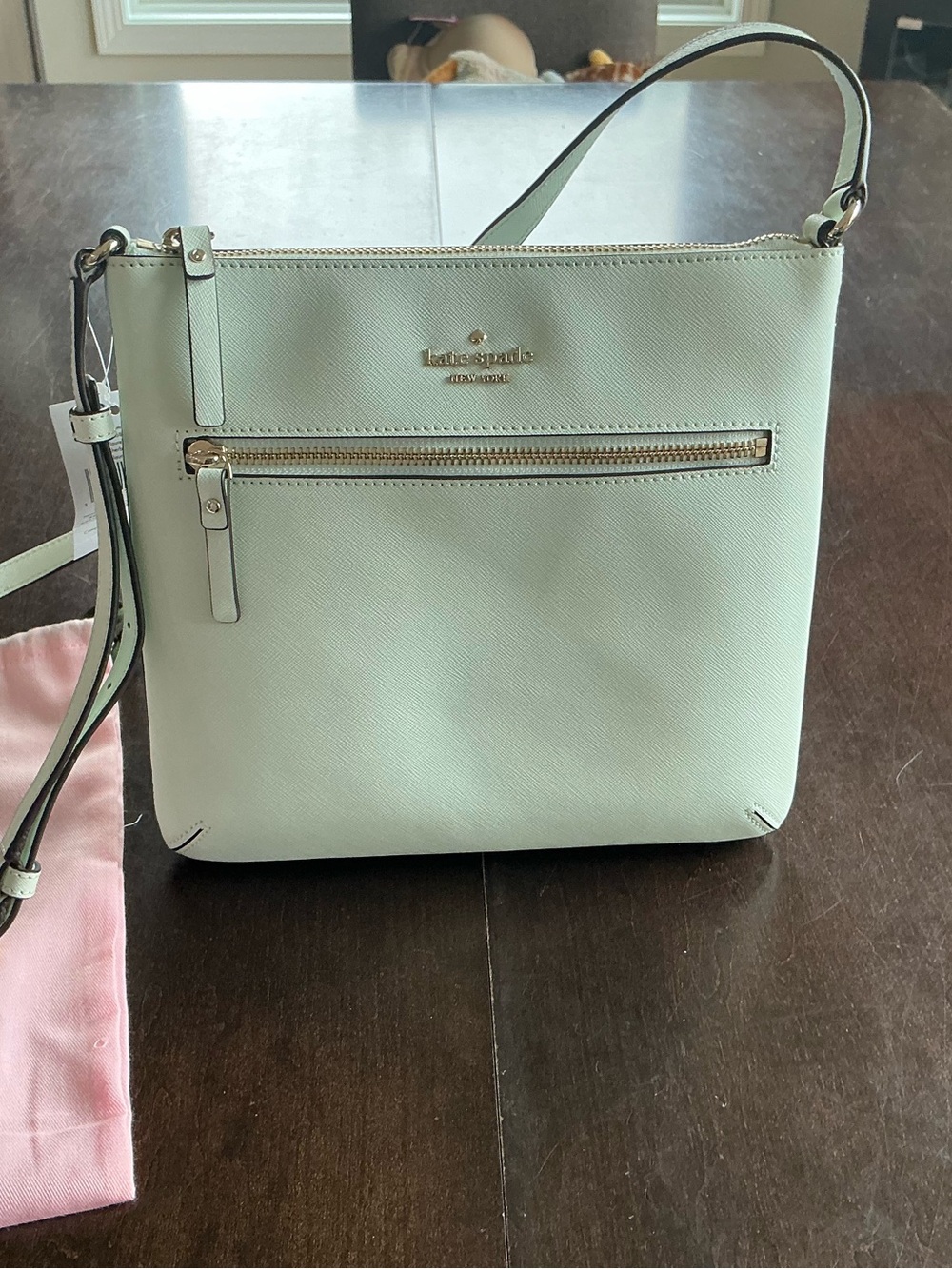 kate spade mint green crossbody with front zip and gold hardware